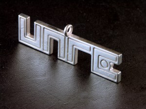 UNRE logo pendant